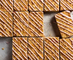 Rows of Oatmeal Apple Bars with Lemon Sumac Drizzle with two missing pieces