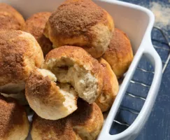 Pile of sweet rolls in casserole dish