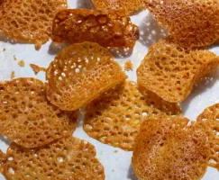Orange-scented lace tuiles on a marble counter
