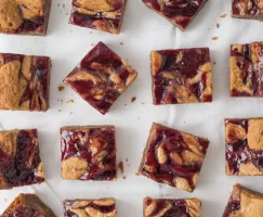 Peanut Butter and Jelly Bars on parchment paper